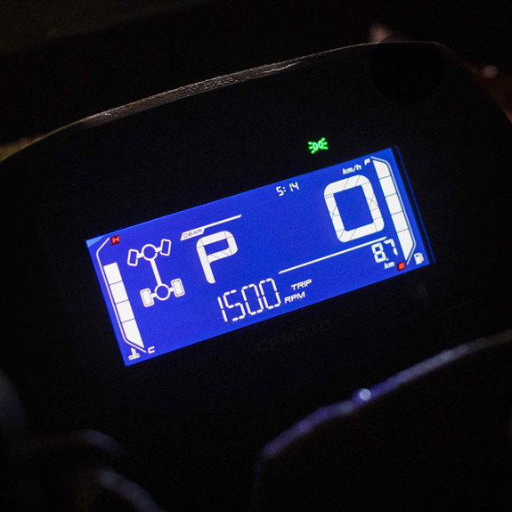 Close-up of a blue digital dashboard display on the CForce 520, showing gear in park, speed at 0 km/h, trip at 1500, and various indicator lights.