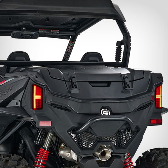 Rear view of a black zforce 950 sport off-road utility vehicle showcasing taillights, suspension springs, and spacious storage cargo area.