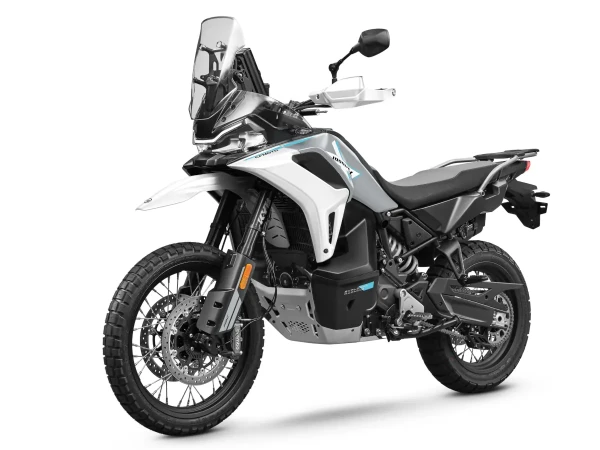 A white and black 1000MT-X adventure motorbike with off-road tyres, tall windscreen, and high ground clearance is photographed on a plain white background.