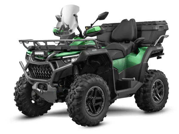 The CForce 1000 Touring Premium is a versatile green all-terrain quad bike, equipped with large tires, a front grill, windshield, and rear storage box. This powerful machine is captured from the front-left angle, ready for any adventure.