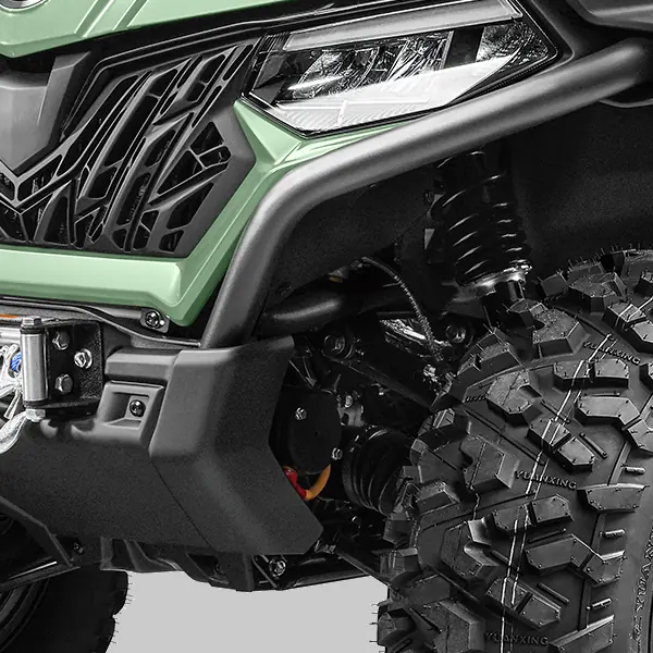 625 suspension Close-up of a rugged cforce 625 basic off-road vehicle’s front section, featuring a green exterior, headlight, suspension system, and large knobby tire.