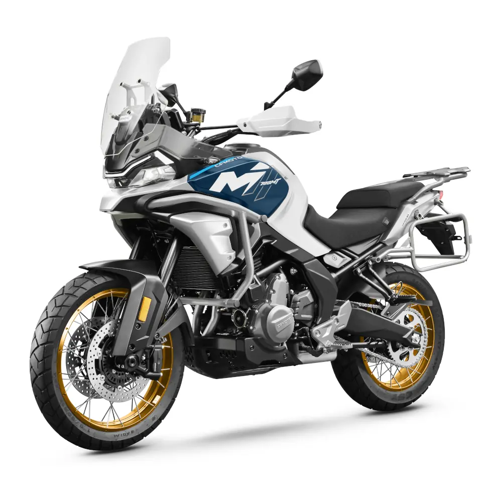 A modern adventure touring motorcycle from CFMoto Motorcycles, featuring gold spoked wheels, a tall windscreen, and striking blue and white bodywork displayed on a white background.