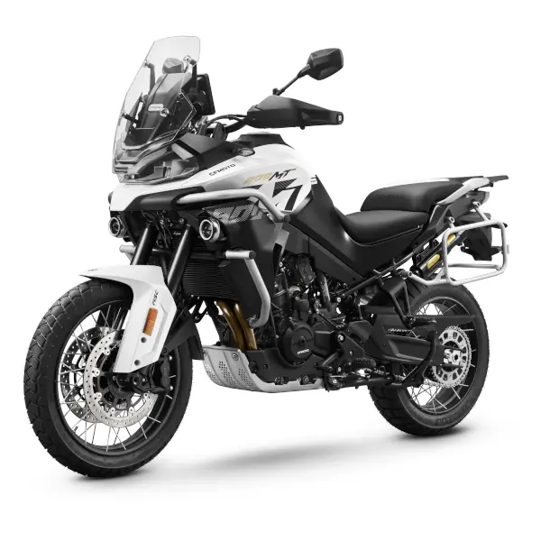 A white and black CFMoto adventure motorbike with a windscreen, knobbly tyres, and side luggage rack, shown on a plain white background.