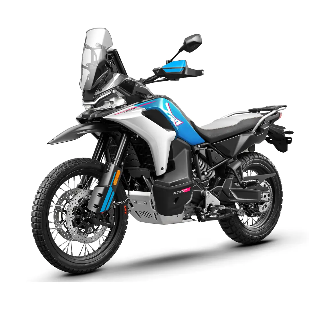 A blue, white, and black adventure motorcycle from CFMoto Motorcycles with off-road tires, a tall windshield, and side mirrors, shown from a front-side angle on a white background.