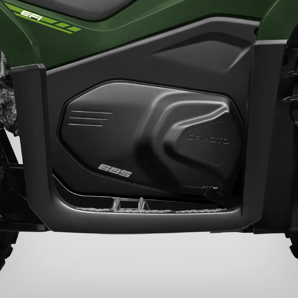 Close-up view of the side panel and footrest area of a green CFMOTO cforce 450 vehicle, showing "EBS" and "EFI" labels on the body.