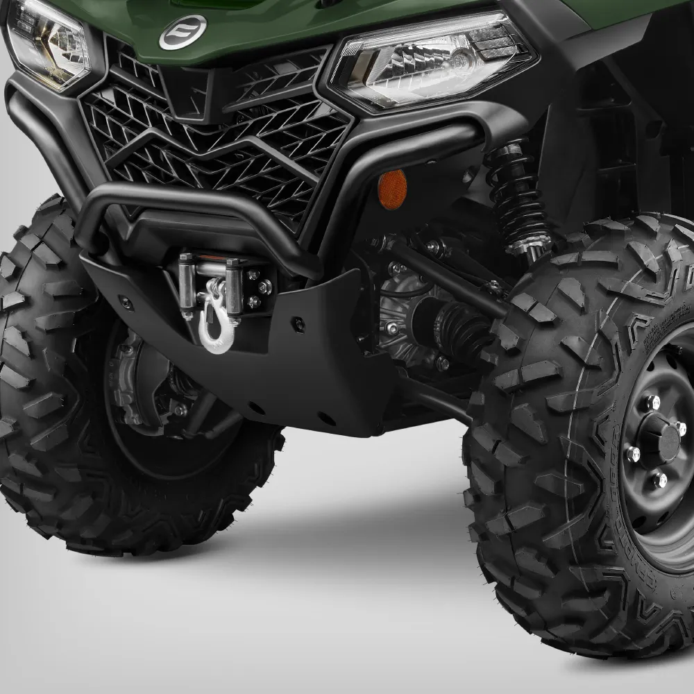 Close-up of the front end of a CForce 450 off-road ATV showing large rugged tires, black bumper, winch hook, and part of the green body.