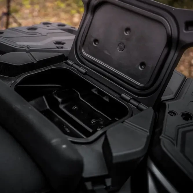 A close-up of an open, empty storage compartment on the UFORCE U10 XL PRO all-terrain vehicle, showing the lid raised and molded interior details.