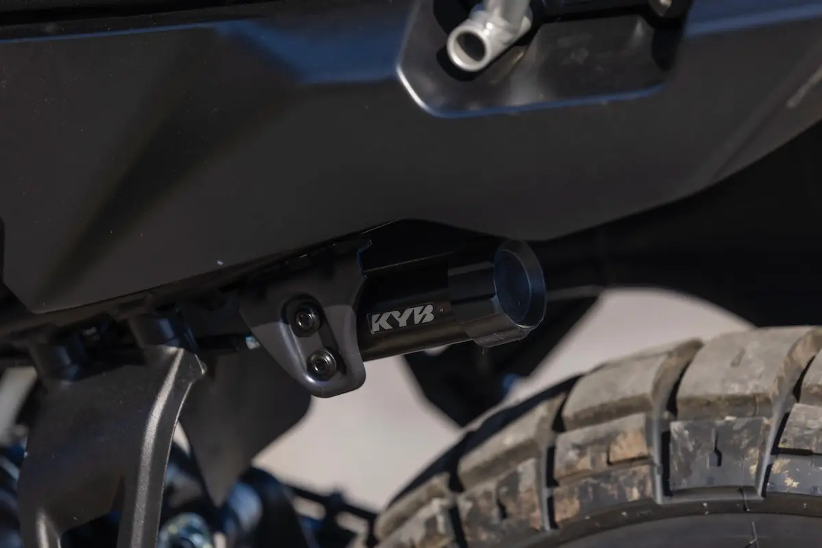 Close-up view of a KYB branded suspension component mounted near the wheel of the CFMOTO 1000MT-X, with visible tyre tread—perfect for detailed inspection in any CFMOTO 1000MT-X review.