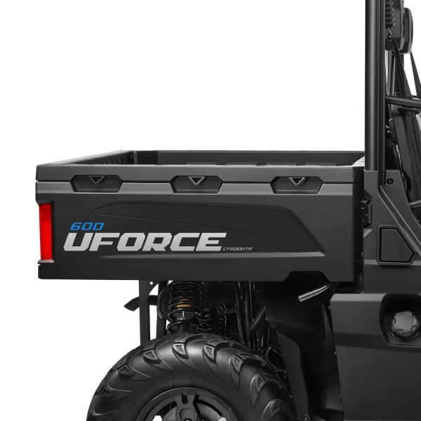 Close-up view of the rear side of a black UFORCE 600 utility vehicle, highlighting the uforce 600's cargo bed, wheel, and part of the suspension system.