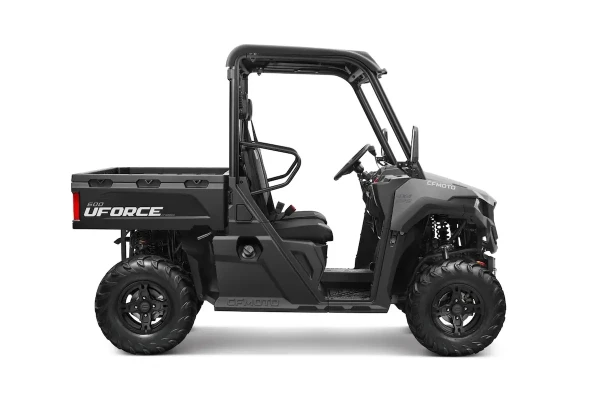 A side view of a black CFMOTO UFORCE 600 utility vehicle, ideal for estate management, with off-road tires, two seats, a steering wheel, and a cargo bed.