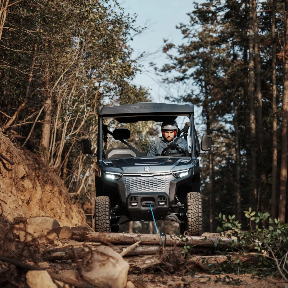 UTV dragging fallen tree UTV dragging fallen tree